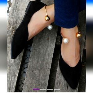 Black women's flats. Fits like a 7.  Cute ankle embellishment. New with bag.